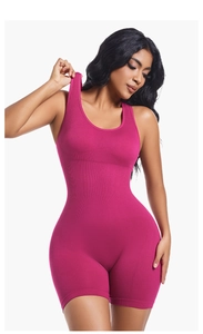 Macro detail of seamless ribbed magenta yoga romper showing fabric texture and stretch