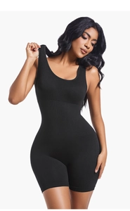 Detail of seamless ribbed black bodysuit featuring U-neck and waist compression design