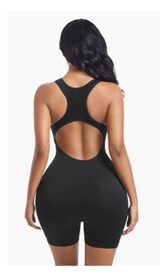 Detail of black ribbed yoga romper showing the open back cutout and racerback design