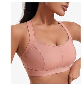 Gros plan d'un soutien-gorge de sport corail montrant le tissu élastique et les coutures