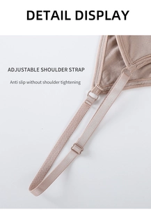 Macro detail of adjustable nude shoulder straps with matching plastic buckles
