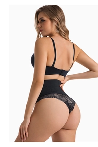 Detail of high waist black lace shaper thong showing tummy control and floral mesh texture