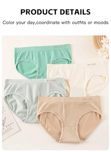 Detail of four seamless high-elasticity panties in soft pastel tones with lettered waist