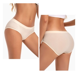 Detail view of seamless low-rise beige panties featuring thin elastic lettered waistband