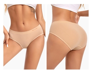 Detailed close-up of seamless nude briefs showing smooth fabric and lettered waistband