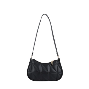 Minimalist black quilted shoulder bag with geometric stitching and gold zipper details
