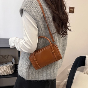 Brown retro PU leather crossbody bag with knot handle and embossed fashion logo