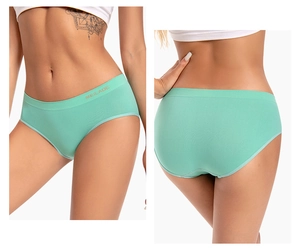 Detail view of mint green seamless high-stretch panties with branded elastic waistband
