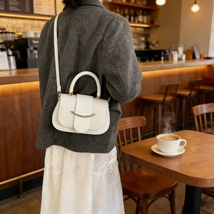 Fashionable white textured saddle bag with gold metal buckle and dual-purpose straps