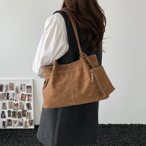 Minimalist brown suede tote bag with white stitching and matching zipper pouch for women