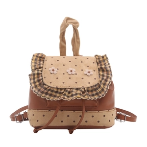 Vintage backpack featuring polka dots, floral accents, and plaid ruffles in beige and brown