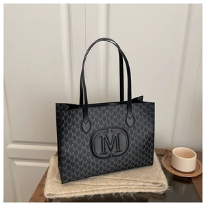 Detail of Harajuku style tote bag with M-letter monogram print and coffee scene