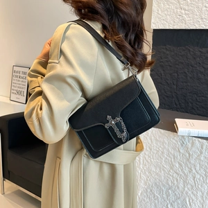 Fashionable black lychee leather crossbody bag with vintage metal cross and chain