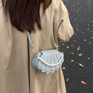 Light blue quilted shell shoulder bag with pearl chain and adjustable leather strap