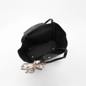 Macro view of black litchi grain tote bag showing spacious interior and silk scarf
