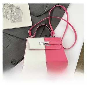 Close-up of color-block trapezoid bag with lychee grain texture and metal clasp