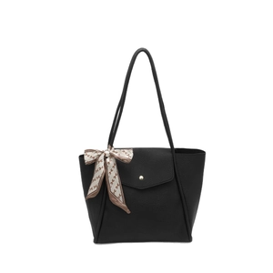 Black pebbled leather tote bag with a golden button pocket and decorative silk scarf