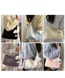 Detailed view of large capacity tote bag in six colors with soft plush charm