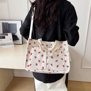 White corduroy strawberry tote bag with double pockets and versatile shoulder straps
