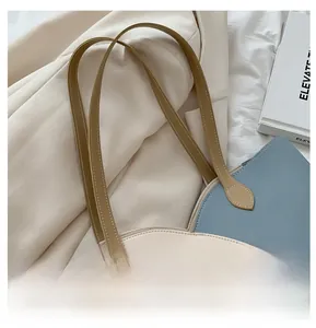 Detail shot of textured leather tote bag straps for stylish urban commute fashion