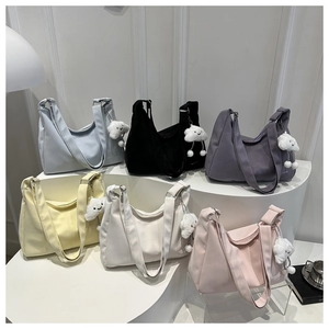 Hobo shoulder bags in six pastel colors with matching wide straps and plush charms