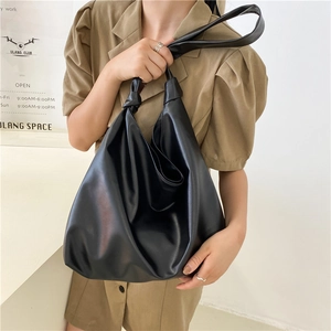 Minimalist black large capacity PU leather tote bag with soft pleated design and wide strap