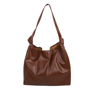 Minimalist large brown PU leather tote bag with knot strap detail and yellow lining