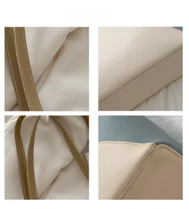 Close-up of contrast stitching and leather strap detail on this minimalist tote bag