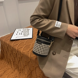 Mini houndstooth cylinder crossbody bag with leather trim and gold zipper for women