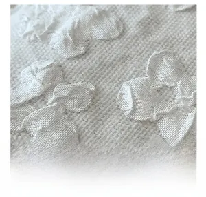 Detailed close-up of 3D floral textured fabric with high-end woven jacquard pattern