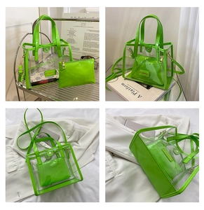 Detail of neon green transparent PVC tote bag with inner pouch and gold hardware
