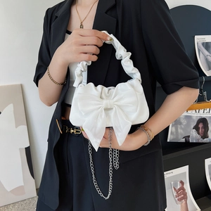 White shoulder bag with large satin bow decoration and elegant ruched handle strap