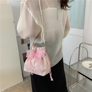 Pink pleated bucket bag with large organza bow and elegant pearl chain strap for women