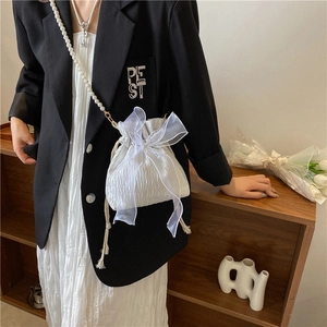 White pleated drawstring bag with large organza bow and pearl chain strap for women