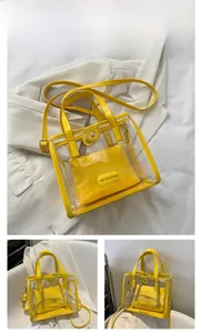 Macro shot of yellow transparent PVC tote bag with shiny inner pouch and top handles