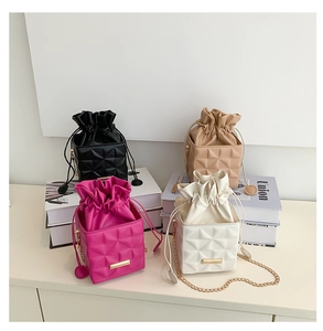 Quilted drawstring bucket bags in four colors with gold chain straps and PU texture