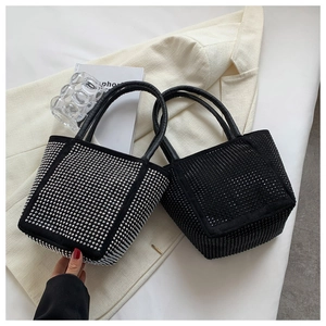 Detail shot of black rhinestone bucket bags with silver and black crystals on display