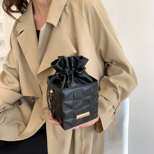 Classic black crossbody bag with gold chain strap and geometric quilted pattern