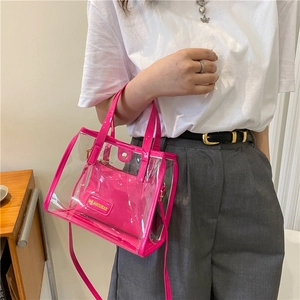 Hot pink transparent PVC tote bag with matching inner pouch and leather handles