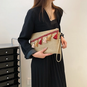 Bohemian woven envelope clutch with colorful tassels and ethnic pattern for women