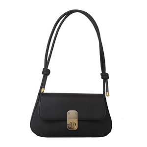 Minimalist black faux leather rectangular crossbody bag with golden metal buckle and knot strap