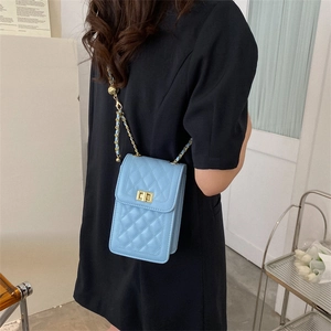 Sky blue quilted crossbody bag with gold chain strap and lock buckle for women