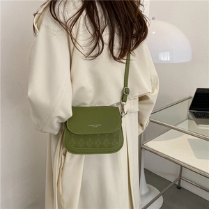 Green saddle crossbody bag for women with fashion trend logo and quilted texture