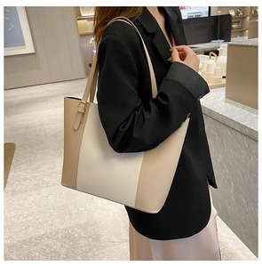 Detail of color-block large tote bag with adjustable shoulder strap for women