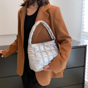 Silver quilted tote bag with metallic finish and puffy square pattern for women