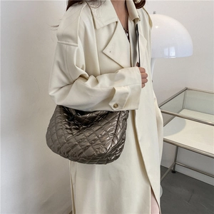 Chic quilted bronze puffer shoulder bag with a metallic finish for women's winter fashion