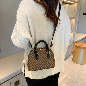Brown vintage geometric Boston bag with black handles and adjustable shoulder strap