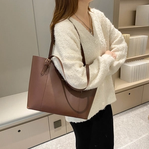 Deep brown large capacity tote bag with adjustable gold buckle for commute
