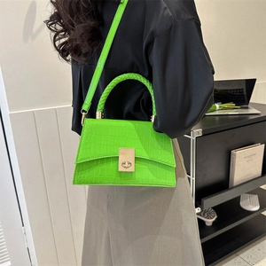 Modern bright green crocodile texture handbag with woven handle and gold metal twist lock