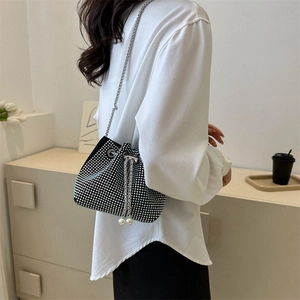 Chic vintage style silver rhinestone bucket bag with chain strap and pearl drawstring